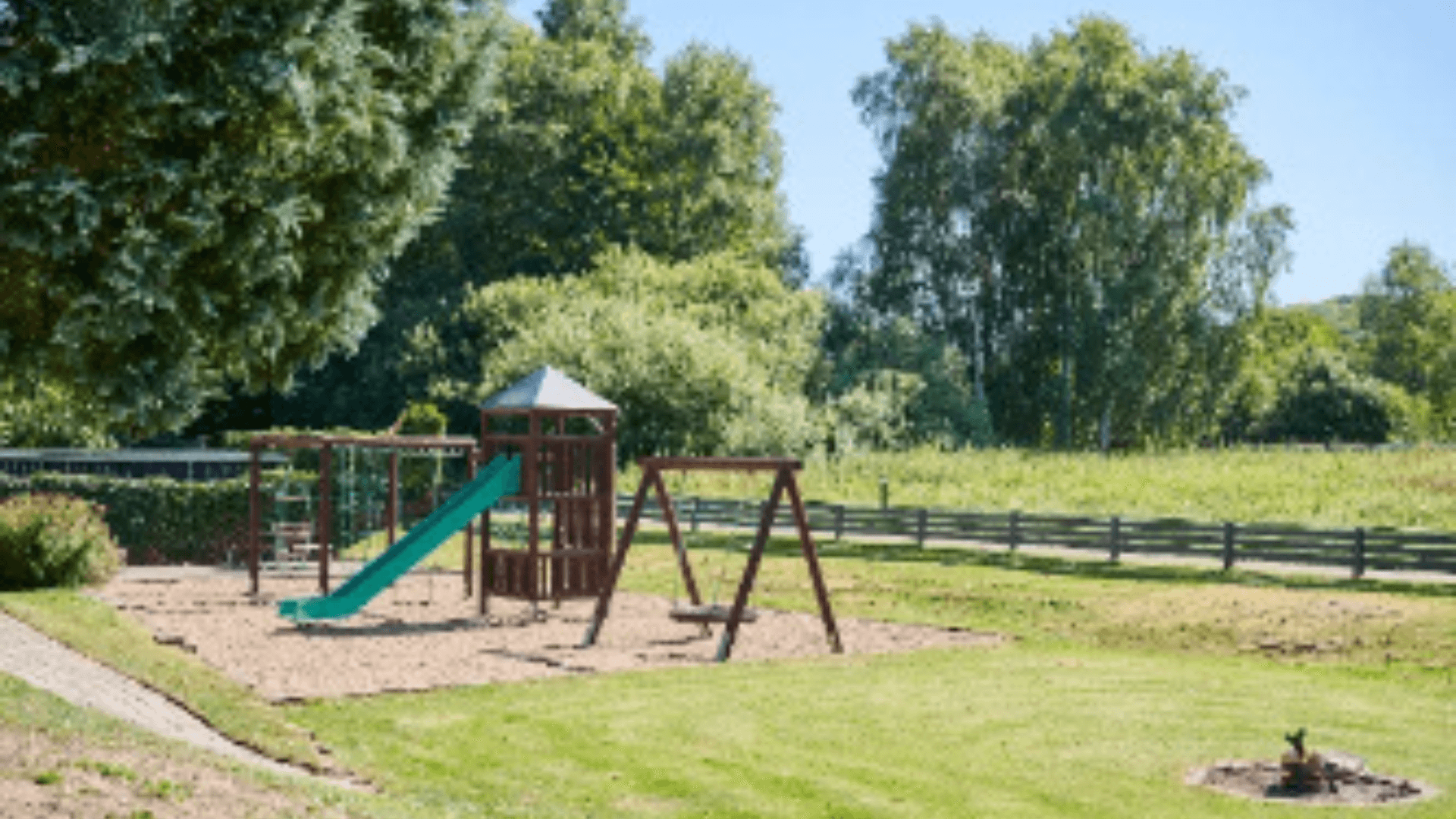 Playground and fire pit in front of the Danhostel in Vejle